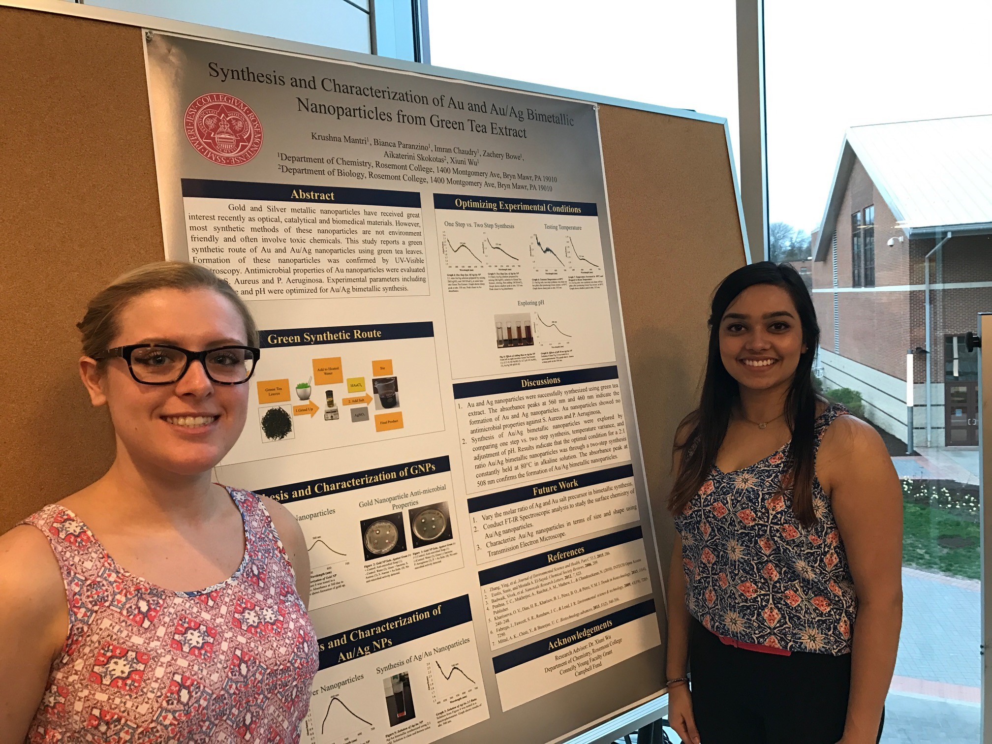 Bianca Paranzino and Krushna Mantri stand in front of their award-winning poster